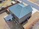 Aerial view of a home showcasing the backyard patio and blue roof at 520 Ballyshannon Dr, Dacula, GA 30019