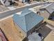 Drone shot shows backyard with patio and neighboring homes at 520 Ballyshannon Dr, Dacula, GA 30019