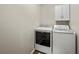 Laundry room with a modern washer and dryer at 520 Ballyshannon Dr, Dacula, GA 30019
