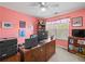 Office space featuring pink walls, a ceiling fan, window and blinds, desk with 2 monitors at 520 Ballyshannon Dr, Dacula, GA 30019