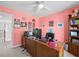 Office space featuring pink walls, a ceiling fan, window and blinds, desk with monitor at 520 Ballyshannon Dr, Dacula, GA 30019
