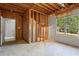 Unfinished basement space with exposed framing, rough-in utilities, and a window with views of the backyard at 74 Rotunda Ct, Dallas, GA 30157