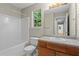 Clean bathroom features a tub, tile surround, and updated vanity providing a comfortable space to relax at 74 Rotunda Ct, Dallas, GA 30157