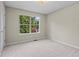 Neutral bedroom with large window providing lots of natural light and views of the surrounding landscape at 74 Rotunda Ct, Dallas, GA 30157