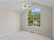 Inviting bedroom featuring vaulted ceiling, ceiling fan, and a large window for ample natural light at 74 Rotunda Ct, Dallas, GA 30157