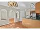 Light-filled dining area with hardwood floors, archways, and kitchen pass-through, perfect for easy entertaining at 74 Rotunda Ct, Dallas, GA 30157