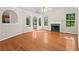 Spacious living room features hardwood floors, fireplace, and ample natural light from multiple windows at 74 Rotunda Ct, Dallas, GA 30157