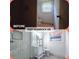 Before and after of a bathroom with updated shower, vanity, and flooring at 2400 Glenrock Dr, Decatur, GA 30032