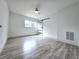 Bedroom with sleek hard surface floors, barn door, and window at 2400 Glenrock Dr, Decatur, GA 30032