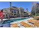 Sprawling backyard with pool, spa, lounge chairs, and outdoor dining perfect for entertaining at 2892 Darlington Run, Duluth, GA 30097