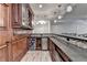 A stylish bar features custom wood cabinetry, granite countertops, a mini-fridge, and sleek tile accents at 2892 Darlington Run, Duluth, GA 30097