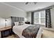 A serene bedroom with a comfortable bed, stylish curtains, and soft, inviting carpet at 2892 Darlington Run, Duluth, GA 30097