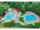 Overhead shot of a community pool featuring a kiddie pool and lap lanes, surrounded by lounge chairs at 2892 Darlington Run, Duluth, GA 30097