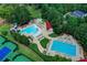 Aerial view of a sparkling swimming pool area with a slide and lounge chairs at 2892 Darlington Run, Duluth, GA 30097