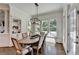 Elegant dining room with hardwood floors, built-in shelving, and a view of the backyard at 2892 Darlington Run, Duluth, GA 30097