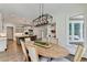 Bright dining room with natural light and hardwood floors next to the kitchen at 2892 Darlington Run, Duluth, GA 30097