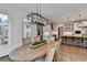Open dining room with an eating area connected to a modern kitchen at 2892 Darlington Run, Duluth, GA 30097