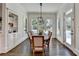 Bright dining room featuring hardwood floors, natural light, and a modern chandelier at 2892 Darlington Run, Duluth, GA 30097