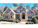 Beautiful brick home featuring a stone facade, manicured landscaping, and a welcoming front entrance at 2892 Darlington Run, Duluth, GA 30097