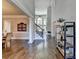 Bright and airy foyer with hardwood floors, staircase, and decorative shelving at 2892 Darlington Run, Duluth, GA 30097