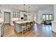 Open concept kitchen with an island, stainless steel appliances, and hardwood floors at 2892 Darlington Run, Duluth, GA 30097
