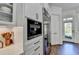 Bright kitchen featuring modern stainless steel appliances and white cabinetry at 2892 Darlington Run, Duluth, GA 30097