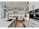 Modern kitchen features stainless steel appliances, subway tile backsplash, and hardwood floors at 2892 Darlington Run, Duluth, GA 30097