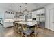 Spacious kitchen with a large island, stainless steel appliances, and modern lighting at 2892 Darlington Run, Duluth, GA 30097