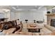Relax in the living room with a stone fireplace, leather couch, and home theater setup for movie nights at 2892 Darlington Run, Duluth, GA 30097