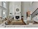 Charming living room with a fireplace, large windows, and hardwood floors at 2892 Darlington Run, Duluth, GA 30097