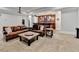 Cozy living room features a wet bar with seating and a leather couch, perfect for gatherings at 2892 Darlington Run, Duluth, GA 30097