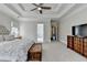 Main bedroom features trey ceilings, a ceiling fan, carpet flooring, and ensuite bathroom at 2892 Darlington Run, Duluth, GA 30097