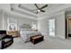 Spacious main bedroom features trey ceilings, a ceiling fan, and neutral paint throughout at 2892 Darlington Run, Duluth, GA 30097