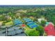 Aerial view of well-maintained tennis courts with blue playing surfaces and lush green surroundings at 2892 Darlington Run, Duluth, GA 30097
