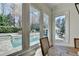 Bright windows show views of the pool, patio, and gazebo outside the dining room at 2892 Darlington Run, Duluth, GA 30097