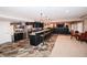 Entertainment area with bar, stools, tile flooring, and dining set at 3045 Camp Branch Rd, Buford, GA 30519