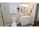 Bathroom featuring a vanity with marble countertops, framed art, and wood-look flooring at 3045 Camp Branch Rd, Buford, GA 30519