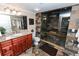 Luxurious bathroom featuring a gorgeous stone shower with seating at 3045 Camp Branch Rd, Buford, GA 30519