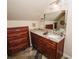 Bathroom featuring granite countertops, wood cabinets, decorative mirror, and unique slate tile flooring at 3045 Camp Branch Rd, Buford, GA 30519