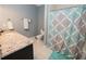 Bathroom featuring granite countertops, a toilet, decorative shower curtain, and soft blue walls at 3045 Camp Branch Rd, Buford, GA 30519