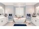 Well-designed bathroom with free standing tub, double sinks and large lighted mirrors at 3045 Camp Branch Rd, Buford, GA 30519