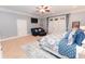 Spacious main bedroom with patio access, sitting area and plush carpet at 3045 Camp Branch Rd, Buford, GA 30519