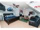 Spacious bedroom with a black leather bed, a flat screen TV, and decor dedicated to the NC Tarheels at 3045 Camp Branch Rd, Buford, GA 30519