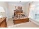Bedroom featuring a plush bed, natural lighting, framed art, and neutral color scheme at 3045 Camp Branch Rd, Buford, GA 30519