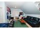 Spacious bedroom with a black leather bed and flat screen TV at 3045 Camp Branch Rd, Buford, GA 30519