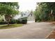 Two-story home featuring a large driveway and three-car garage at 3045 Camp Branch Rd, Buford, GA 30519