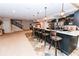 Kitchen area with bar, tile flooring and easy access to living spaces at 3045 Camp Branch Rd, Buford, GA 30519