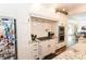Well-equipped kitchen with custom cabinetry, granite countertops, and a stainless steel refrigerator at 3045 Camp Branch Rd, Buford, GA 30519