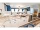 Stylish kitchen with granite countertops and a breakfast bar overlooking the dining area at 3045 Camp Branch Rd, Buford, GA 30519