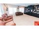Cozy living room with custom built-ins, large windows, and comfortable seating at 3045 Camp Branch Rd, Buford, GA 30519